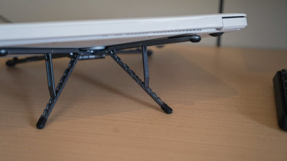 Foldnix magnetic phone stand in a laptop workspace desk setup